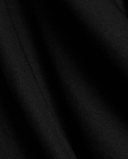 Mens Odin Zip Sport Polo in a rich black, featuring a visible premium pique knit fabric texture, characteristic of Psycho Bunny's refined streetwear style.