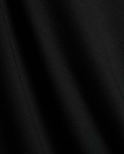 Premium black Mens Timmy Interlock Polo fabric, showcasing a smooth, dense interlock knit with subtle texture and refined drape, embodying Psycho Bunny's sophisticated streetwear style.