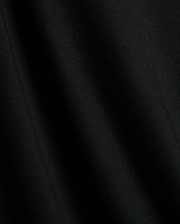 Premium black Mens Timmy Interlock Polo fabric, showcasing a smooth, dense interlock knit with subtle texture and refined drape, embodying Psycho Bunny's sophisticated streetwear style.