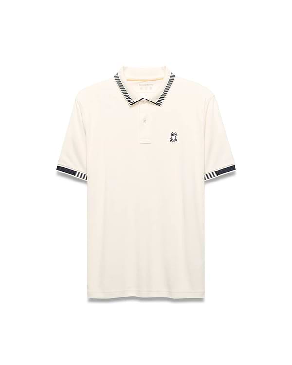Mens Timmy Interlock Polo, cream interlock knit with navy and white striped collar and cuffs, featuring a small embroidered Psycho Bunny skull logo on the left chest.