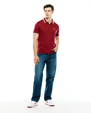 Mens Timmy Interlock Polo, a classic fit maroon interlock knit polo with white tipped collar and cuffs, featuring a small embroidered Psycho Bunny skull logo on the left chest.