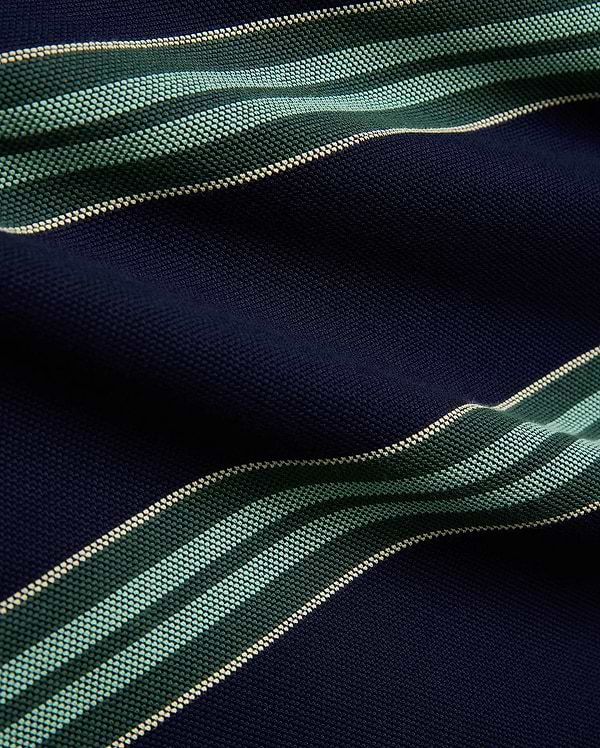 Mens Drew Striped Pique Polo in navy blue, featuring bold horizontal stripes in dark green, light green, and cream, showcasing its textured pique fabric. (7)