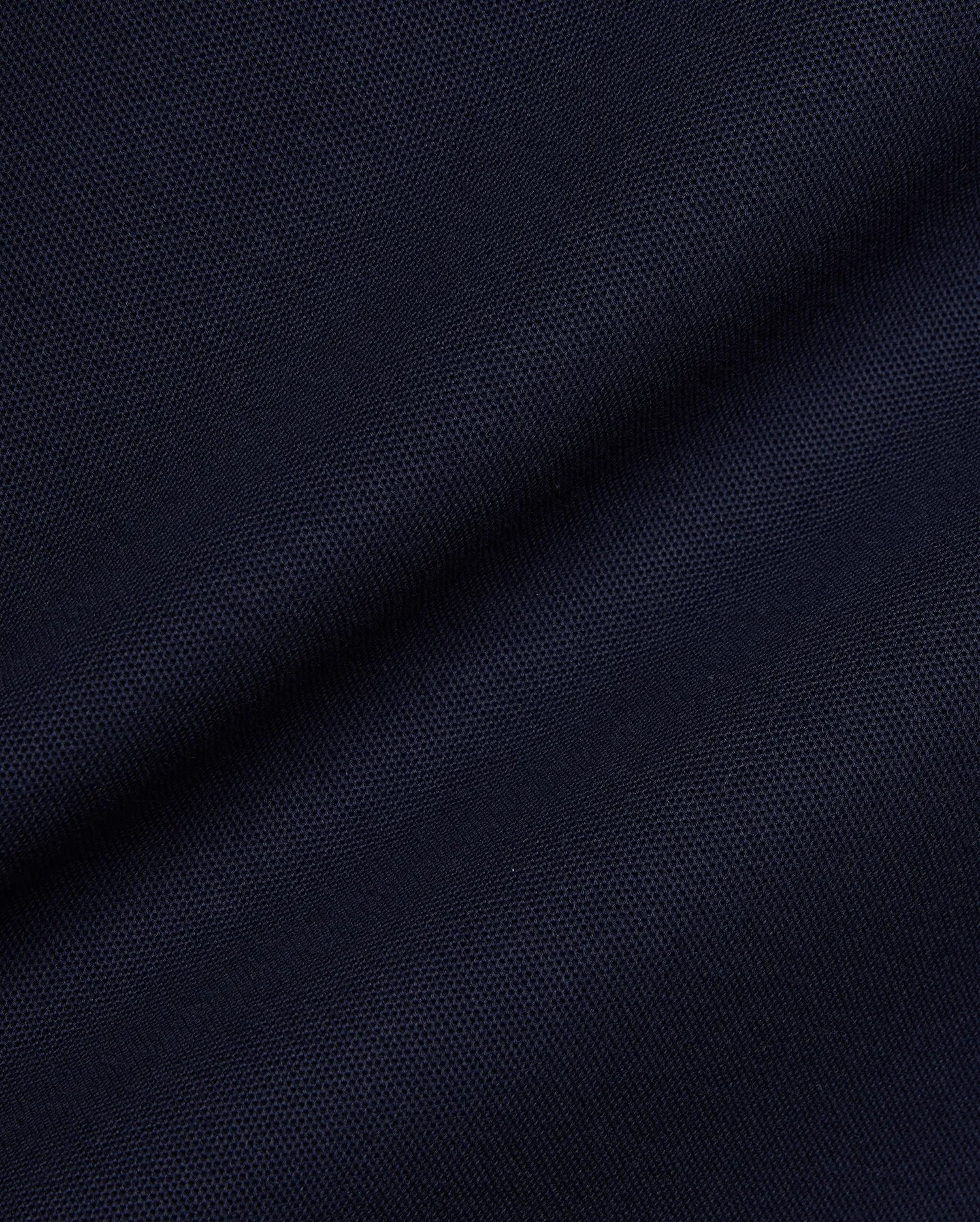 Navy Mens Jaydon Pique Polo, a premium streetwear essential, featuring a classic pique knit texture and the iconic embroidered Psycho Bunny skull logo on the left chest.