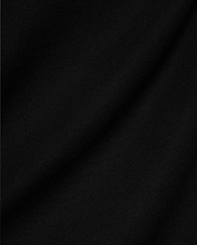 Mens Jaydon Pique Polo, a luxurious black polo crafted from premium, finely woven pique fabric, showcasing its distinctive texture and subtle draping, embodying Psycho Bunny's sophisticated style.
