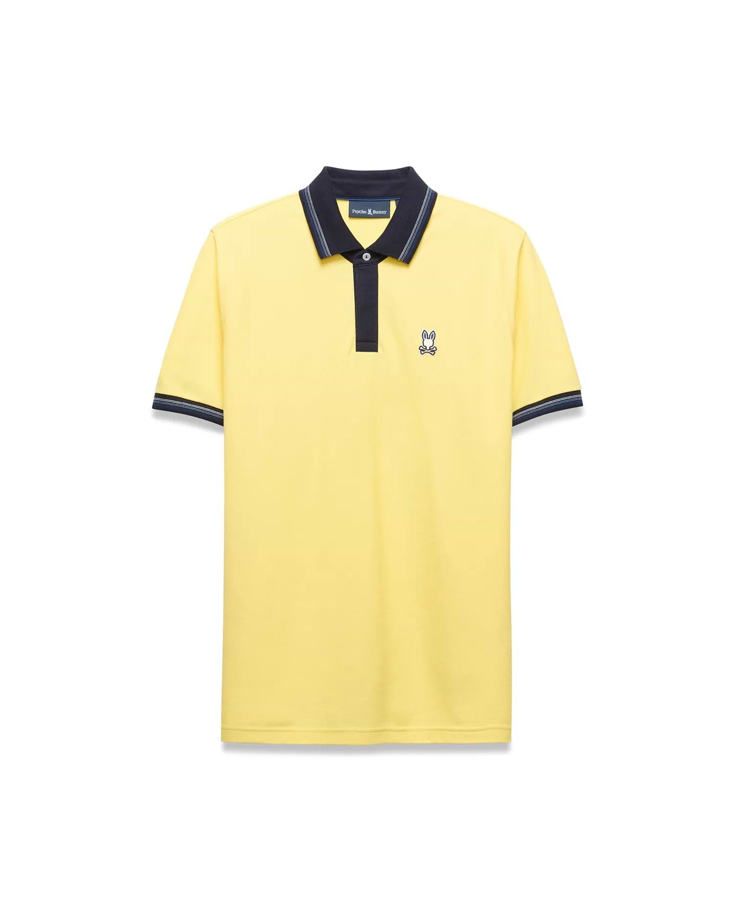 Mens Jaydon Pique Polo in bright yellow, featuring a navy blue collar with white tipping, a two-button placket, ribbed cuffs with matching stripes, and a small embroidered Psycho Bunny logo on the left chest for a classic fit.
