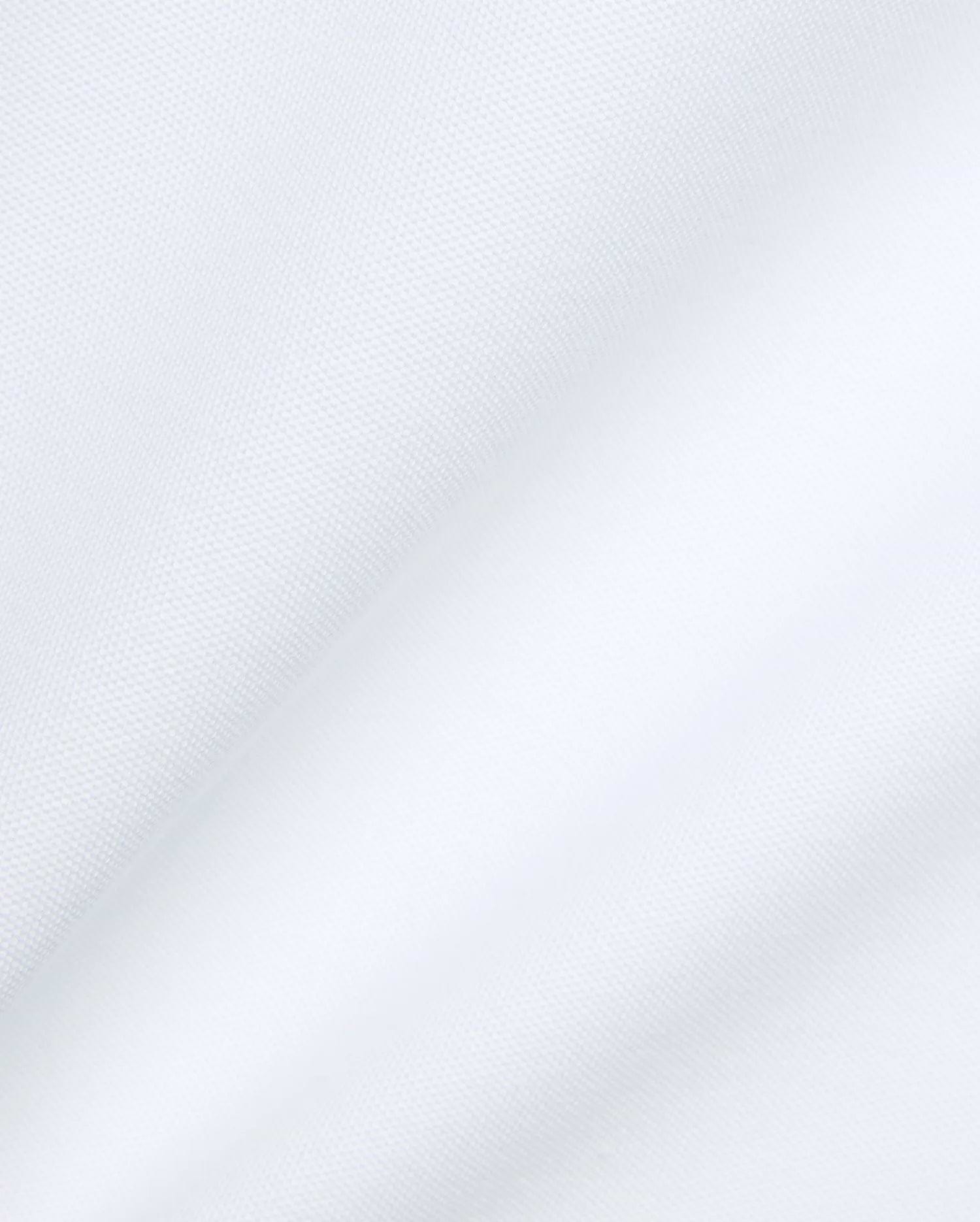 Psycho Bunny Mens Jaydon Pique Polo in crisp white, featuring the iconic brand's premium textured pique fabric with subtle folds, embodying refined streetwear.