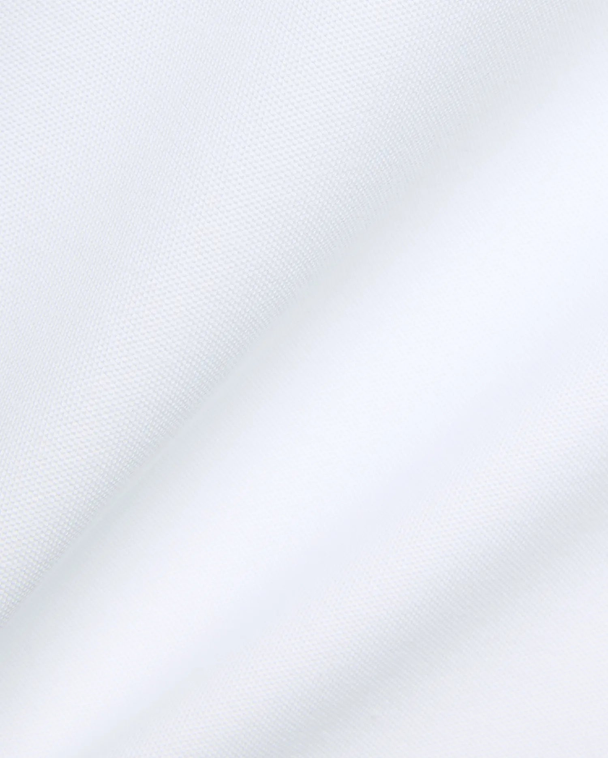 Psycho Bunny Mens Jaydon Pique Polo in crisp white, featuring the iconic brand's premium textured pique fabric with subtle folds, embodying refined streetwear.