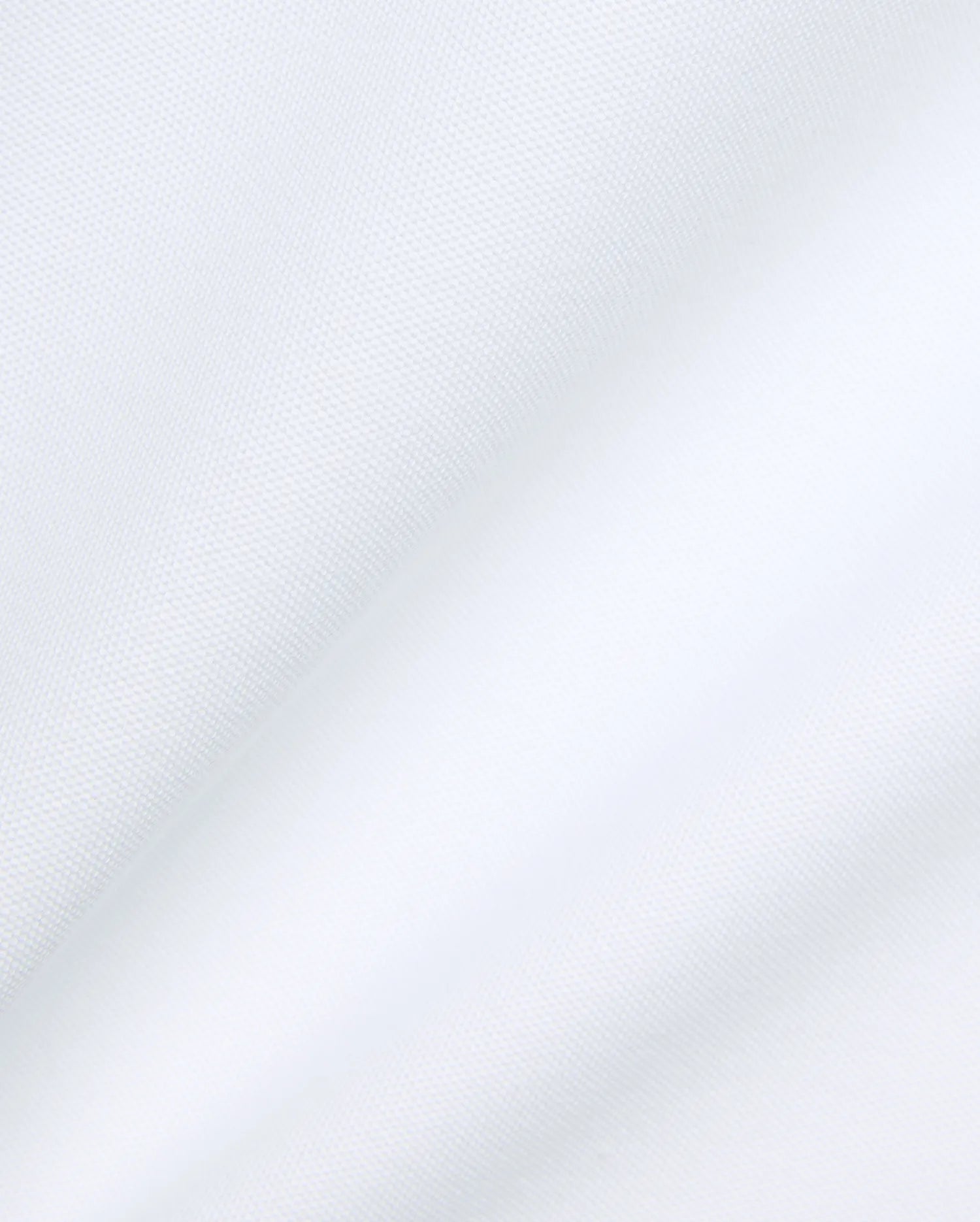 Psycho Bunny Mens Jaydon Pique Polo in crisp white, featuring the iconic brand's premium textured pique fabric with subtle folds, embodying refined streetwear.