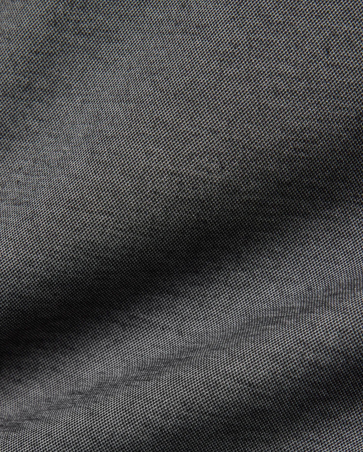 Psycho Bunny MENS JOJI PERFORMANCE POLO in a deep charcoal grey, featuring a premium, subtly textured pique knit fabric, offering a refined streetwear aesthetic and classic fit.