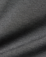 Psycho Bunny MENS JOJI PERFORMANCE POLO in a deep charcoal grey, featuring a premium, subtly textured pique knit fabric, offering a refined streetwear aesthetic and classic fit.