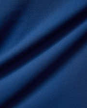 Psycho Bunny Mens Joji Performance Polo in deep blue, featuring a finely textured pique knit fabric, embodying refined streetwear style.