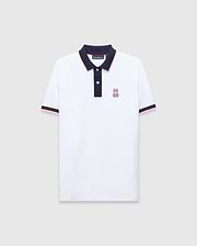 Mens John Pique Polo, a classic fit white pique polo with navy collar and placket, red tipping, navy ribbed cuffs with red stripe, and an embroidered Psycho Bunny skull logo on the left chest.