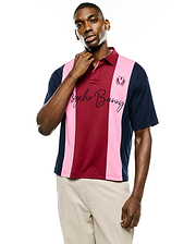Mens Chad Relaxed Fit Striped Polo in burgundy, pink, and navy vertical stripes, featuring a small embroidered bunny skull logo and large Psycho Bunny script on the chest, made from smooth jersey.
