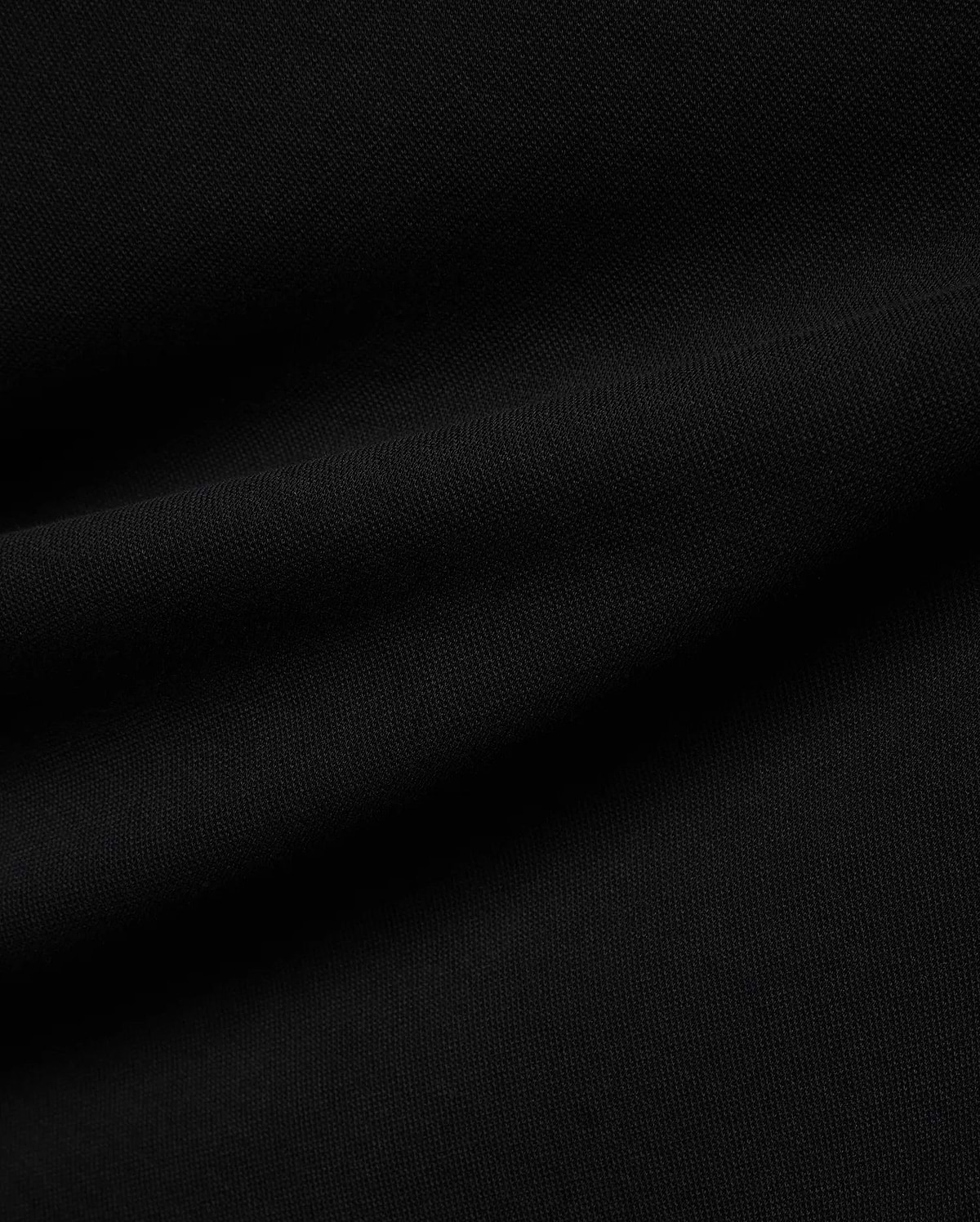Psycho Bunny Mens Ceano Relaxed Fit Heavy Pique Polo in deep black, crafted from premium textured heavy pique fabric, typically featuring the iconic embroidered bunny skull logo on the chest.