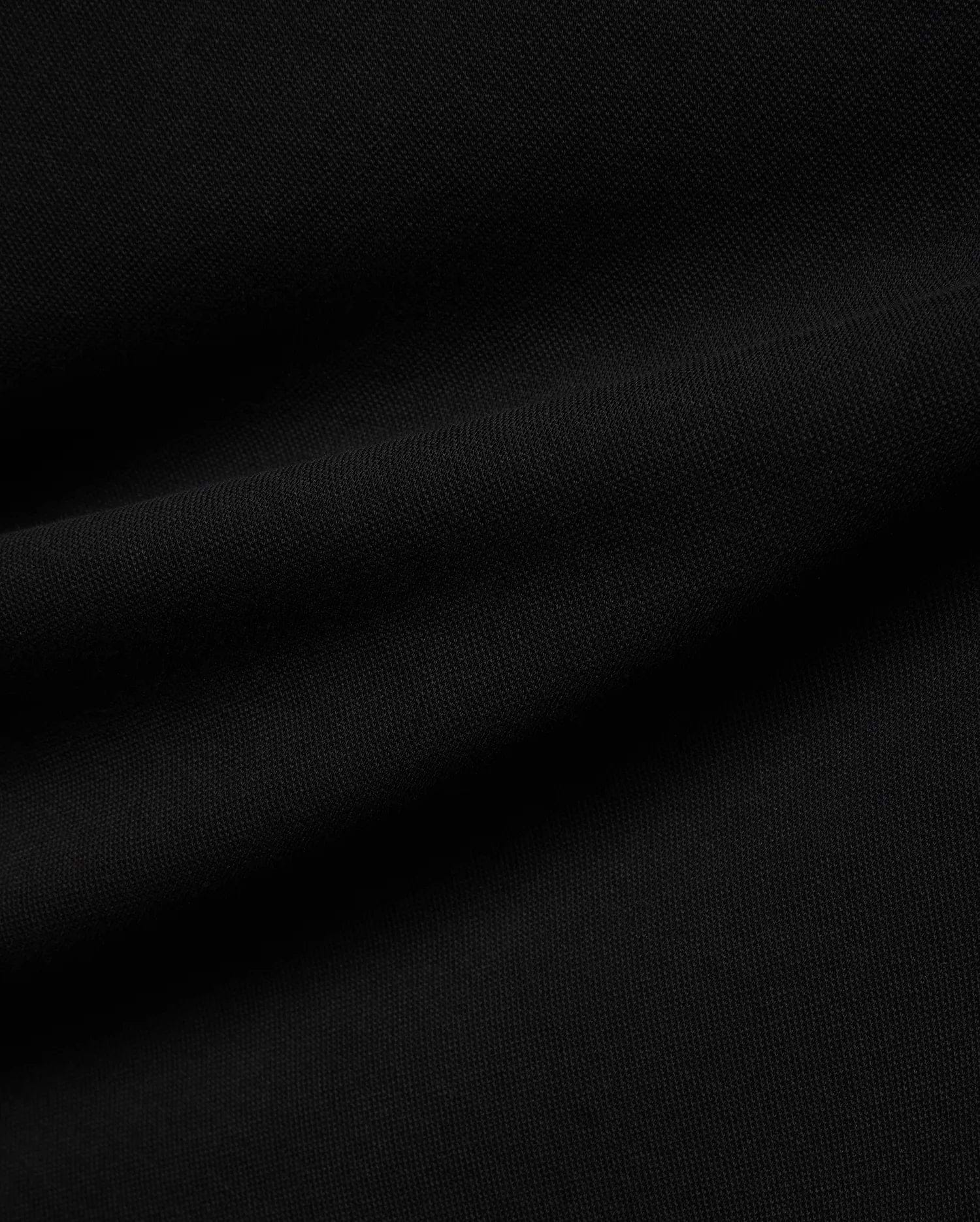 Psycho Bunny Mens Ceano Relaxed Fit Heavy Pique Polo in deep black, crafted from premium textured heavy pique fabric, typically featuring the iconic embroidered bunny skull logo on the chest.