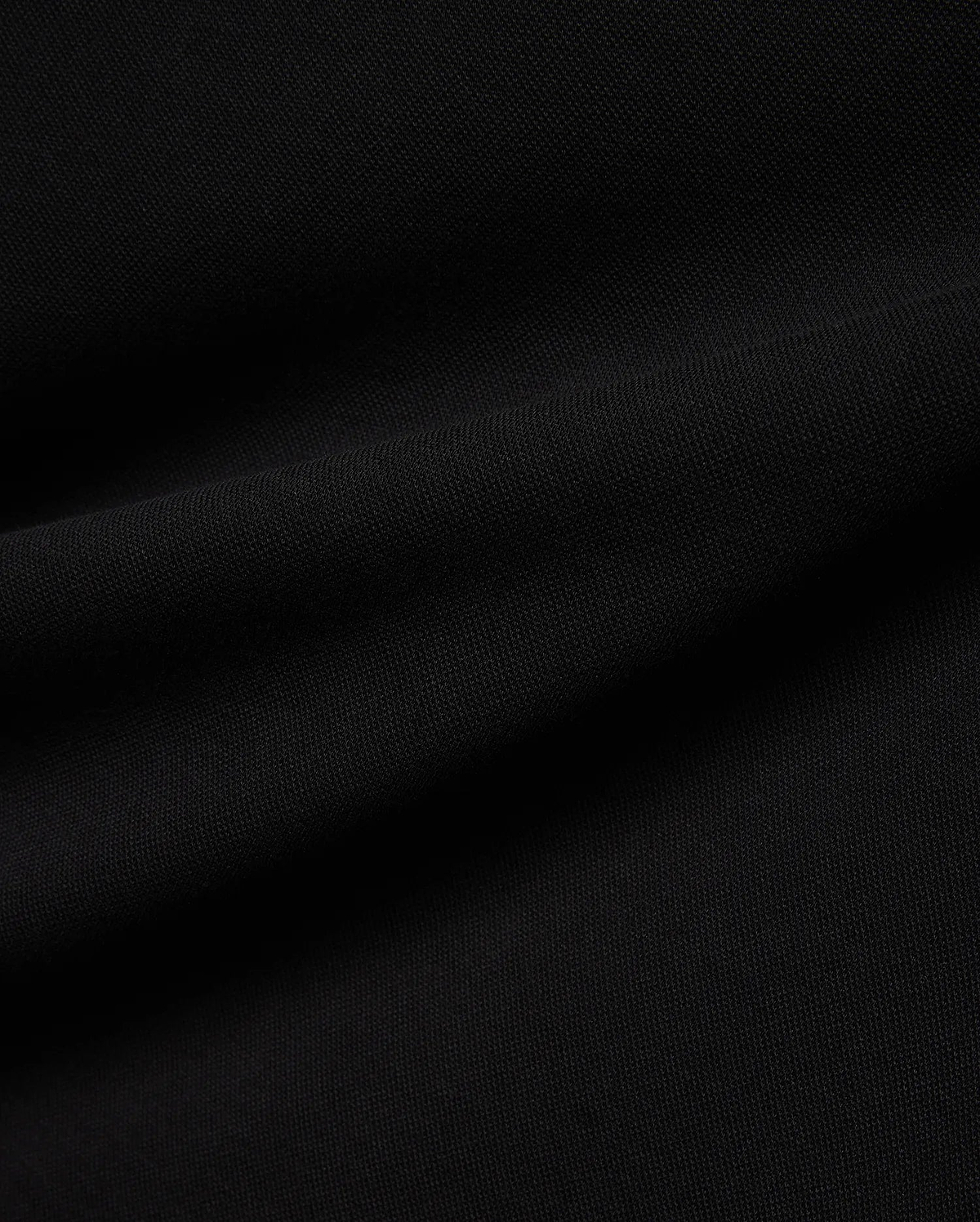 Psycho Bunny Mens Ceano Relaxed Fit Heavy Pique Polo in deep black, crafted from premium textured heavy pique fabric, typically featuring the iconic embroidered bunny skull logo on the chest.