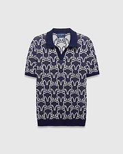 Mens Sidney Oversized Knit Polo in navy with a striking all-over white Psycho Bunny skull logo pattern, featuring a refined knit texture and classic collar.