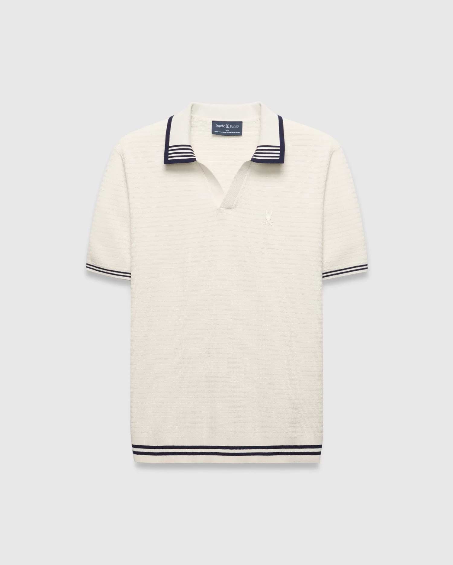 Mens Elowen Knit Polo, cream ribbed knit with navy striped V-neck collar, cuffs, and hem, featuring a small embroidered Psycho Bunny skull logo on the left chest.