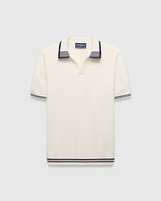 Mens Elowen Knit Polo, cream ribbed knit with navy striped V-neck collar, cuffs, and hem, featuring a small embroidered Psycho Bunny skull logo on the left chest.