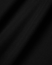 Mens Faye Pique Polo in a rich, deep black, showcasing the refined, breathable textured pique fabric with subtle folds and shadows, emphasizing its premium quality and classic weave.