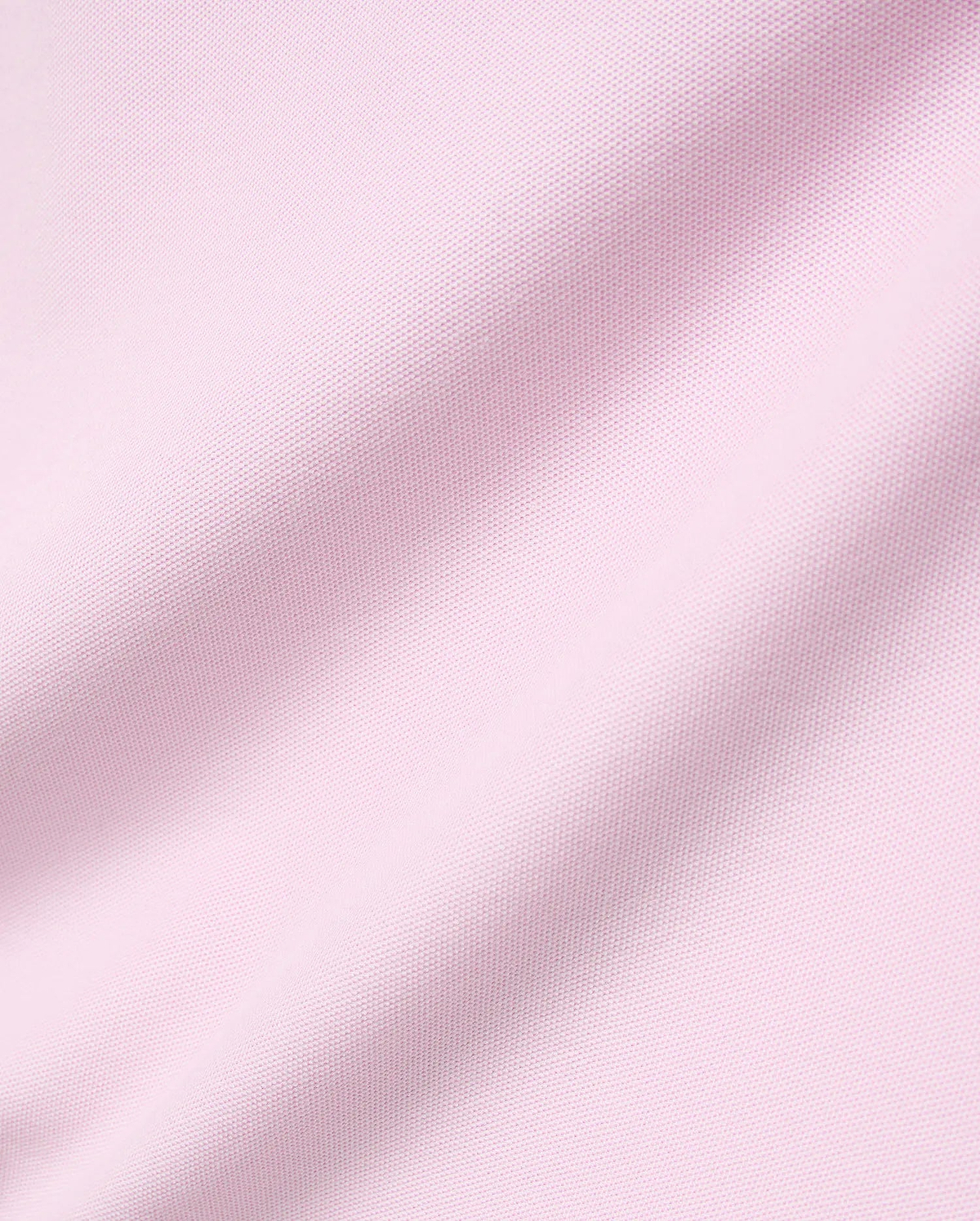 Mens Faye Pique Polo in a soft light pink, featuring a refined, classic pique knit fabric texture with gentle drapes, embodying premium Psycho Bunny style.