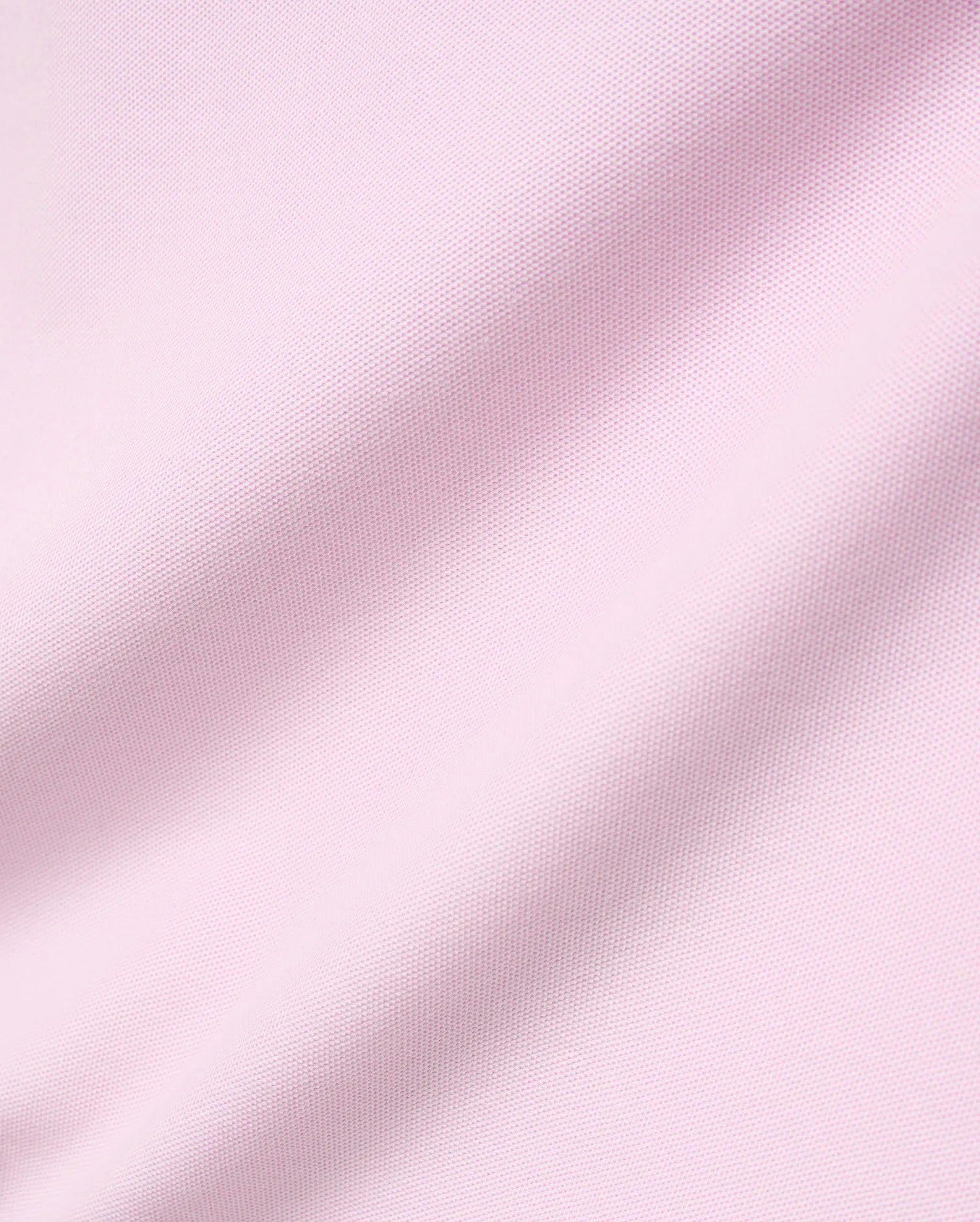 Mens Faye Pique Polo in a soft light pink, featuring a refined, classic pique knit fabric texture with gentle drapes, embodying premium Psycho Bunny style.