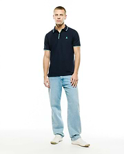 Men's Slade Pique Polo, classic fit navy pique polo shirt with a small embroidered teal Psycho Bunny skull logo on the left chest, featuring ribbed collar and cuffs with teal and white double stripe accents. (4)