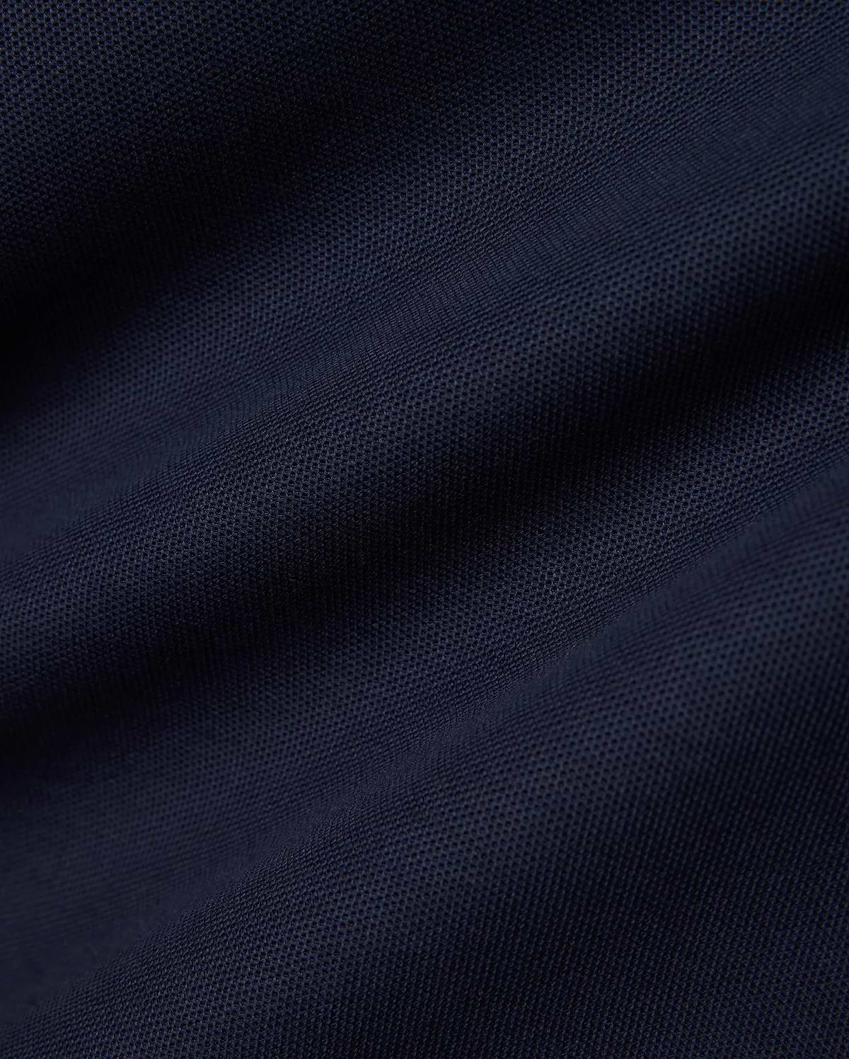 Men's Slade Pique Polo in a rich, dark navy blue, highlighting the premium, breathable pique fabric with its distinctive textured weave, perfect for refined streetwear. (6)