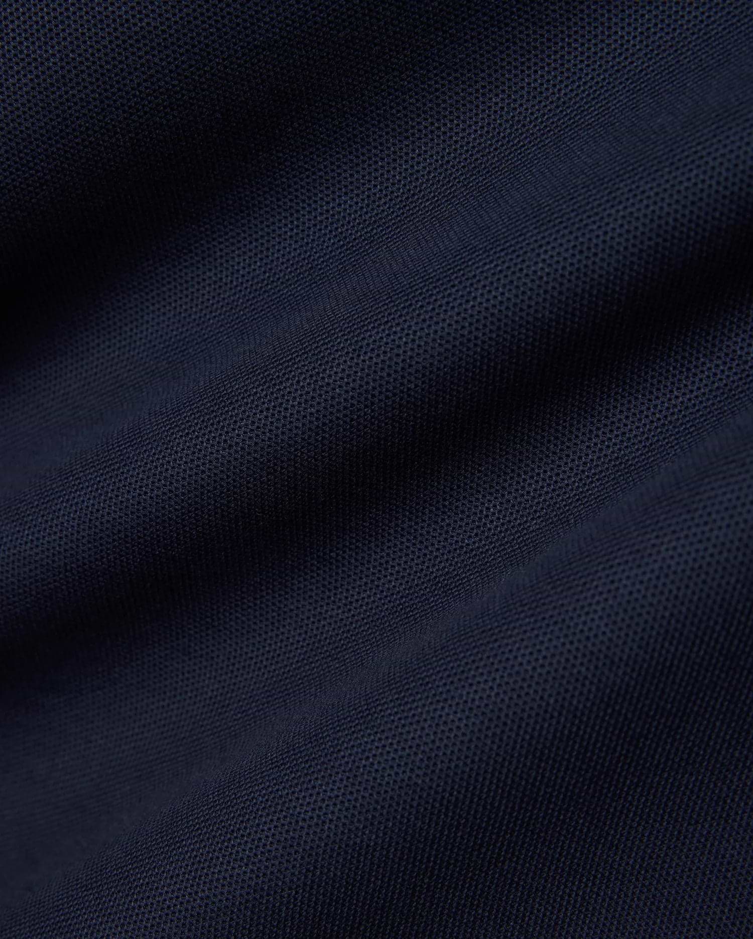 Men's Slade Pique Polo in a rich, dark navy blue, highlighting the premium, breathable pique fabric with its distinctive textured weave, perfect for refined streetwear. (6)