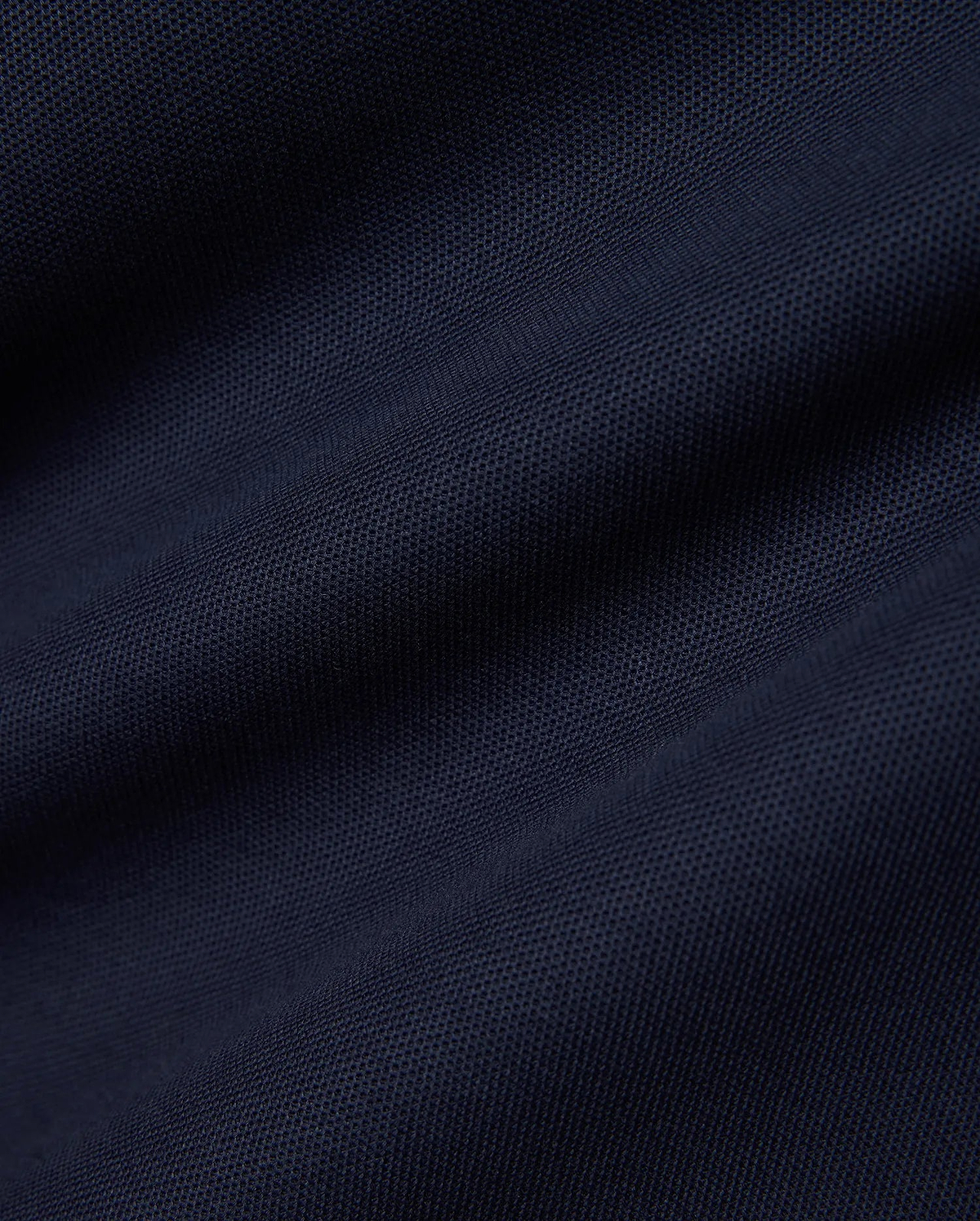 Men's Slade Pique Polo in a rich, dark navy blue, highlighting the premium, breathable pique fabric with its distinctive textured weave, perfect for refined streetwear. (6)