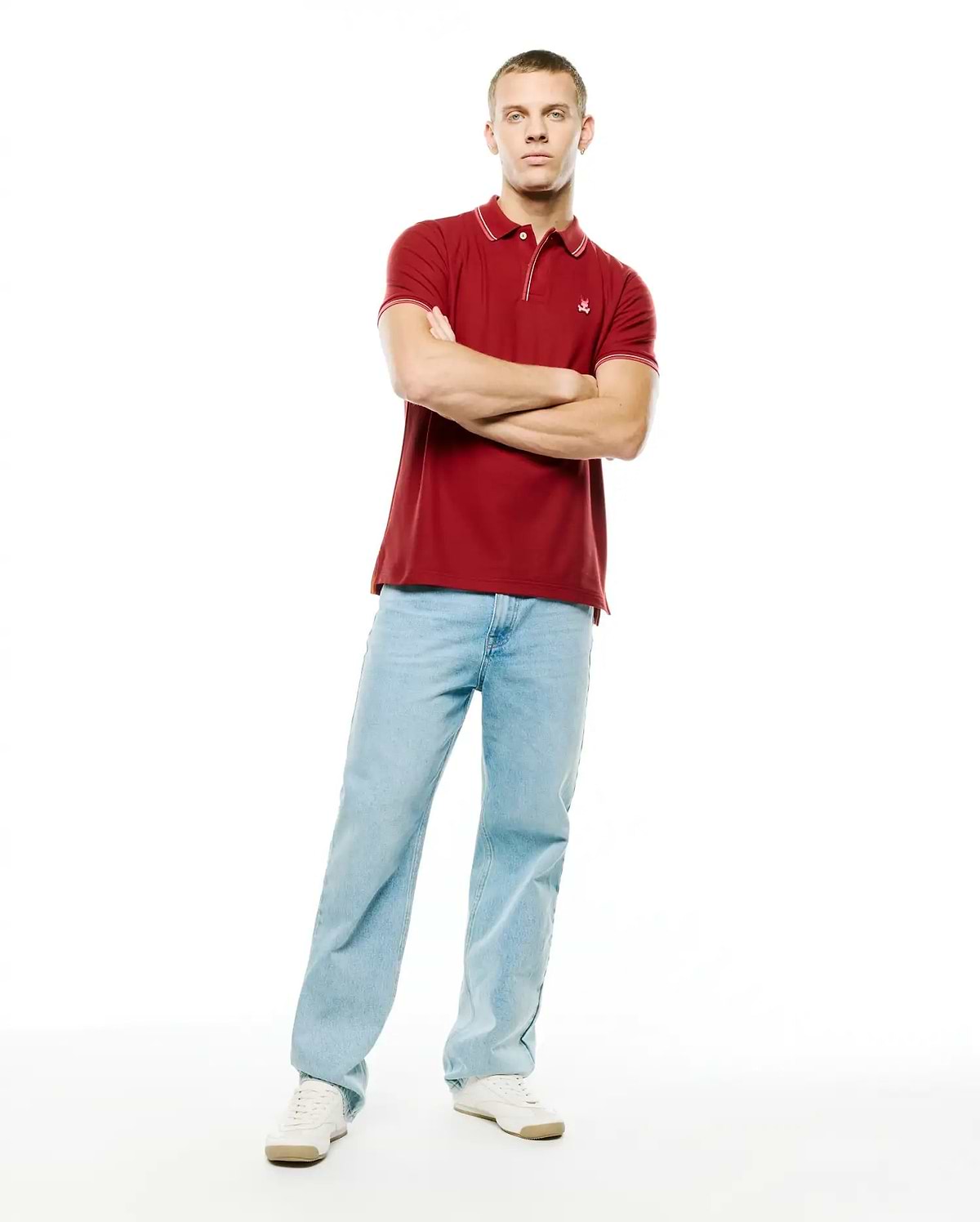 Men's Slade Pique Polo, deep red, classic fit, with white tipped collar and cuffs, featuring a small embroidered Psycho Bunny skull logo on the left chest. (4)