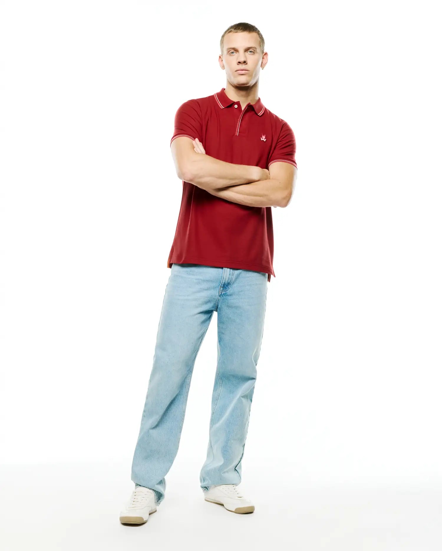 Men's Slade Pique Polo, deep red, classic fit, with white tipped collar and cuffs, featuring a small embroidered Psycho Bunny skull logo on the left chest. (4)