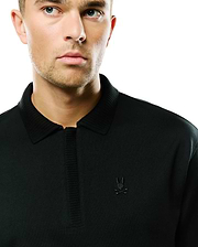 Nolen Oversized Jersey Polo in black, featuring a soft jersey knit, ribbed collar and placket, and a small, tonal embroidered Psycho Bunny skull logo on the left chest for an oversized fit. (2)