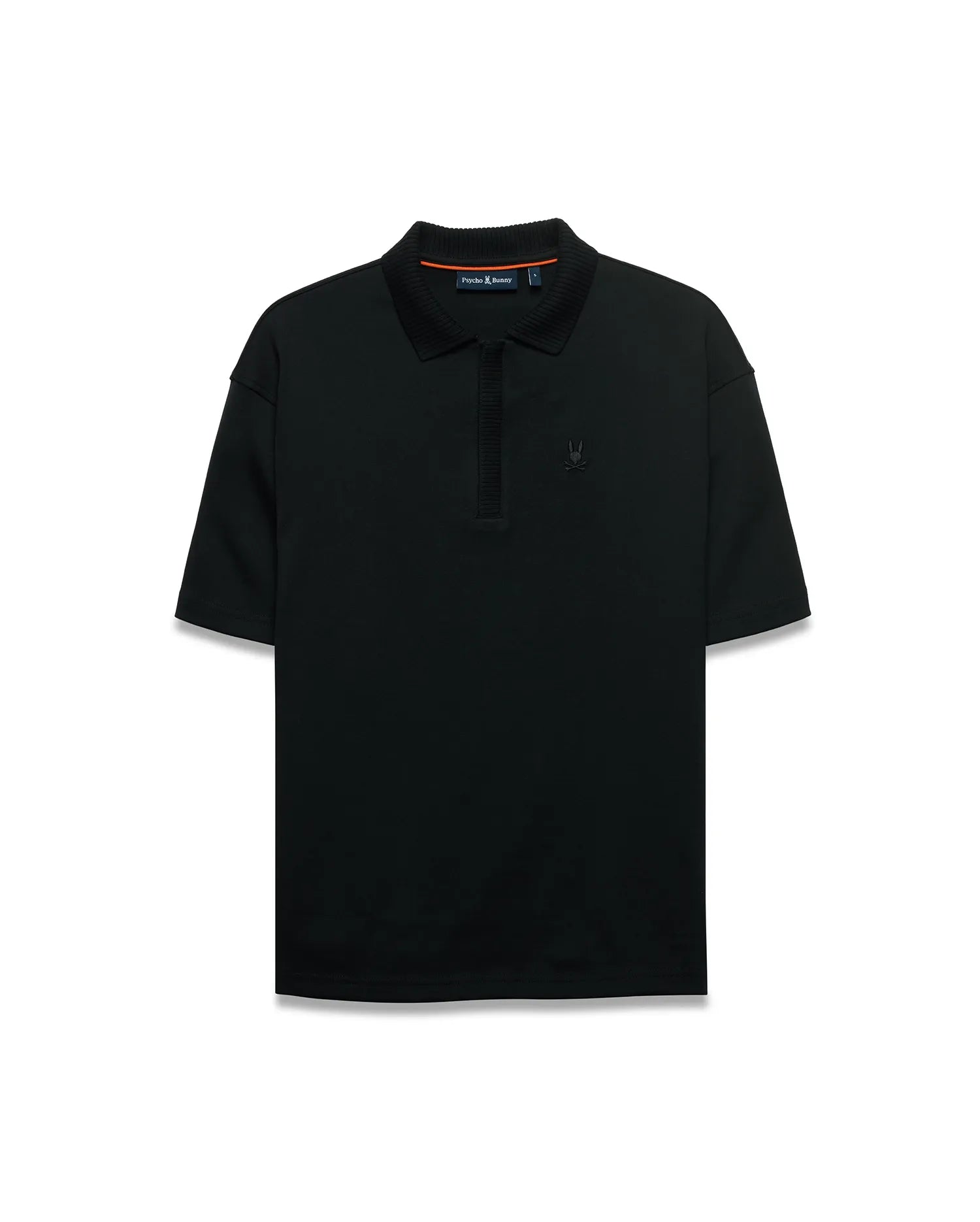 Men's Nolen Oversized Jersey Polo in black jersey fabric, featuring a ribbed collar and placket, with a small embroidered Psycho Bunny skull logo on the left chest and subtle orange accent on the inner collar. (5)