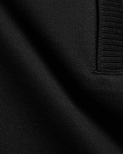 Men's Nolen Oversized Jersey Polo in rich black, highlighting its premium soft jersey knit fabric and a finely ribbed placket detail. (6)
