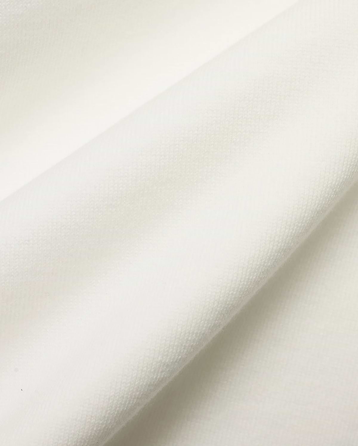 Men's Nolen Oversized Jersey Polo in pristine white, highlighting the luxurious, soft jersey knit fabric with a subtle, refined texture, perfect for premium streetwear. (6)