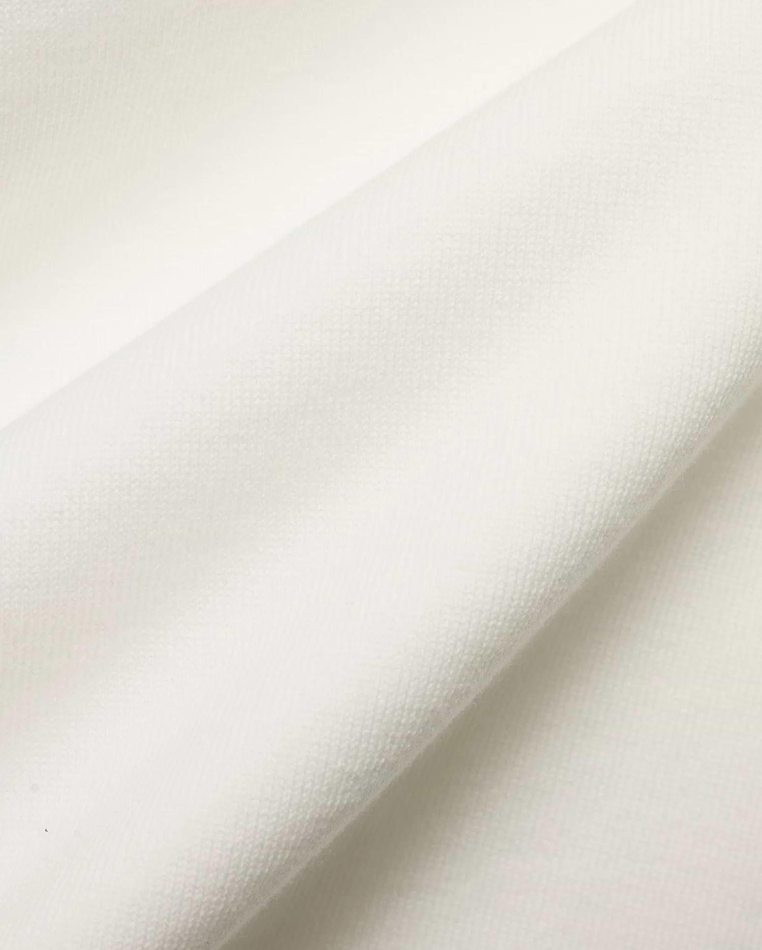 Men's Nolen Oversized Jersey Polo in pristine white, highlighting the luxurious, soft jersey knit fabric with a subtle, refined texture, perfect for premium streetwear. (6)