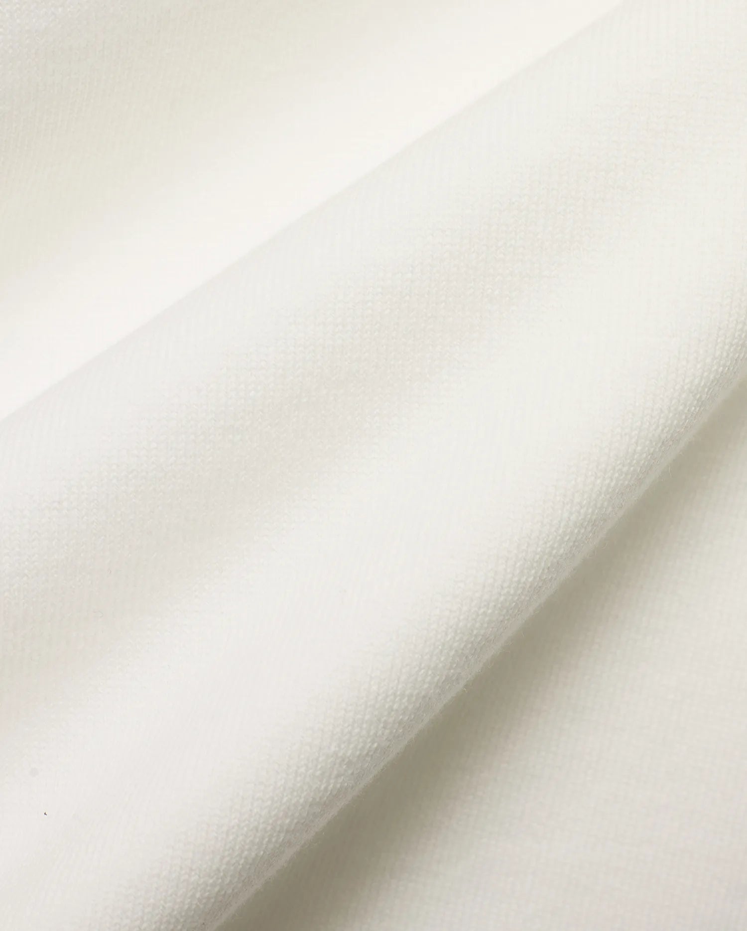 Men's Nolen Oversized Jersey Polo in pristine white, highlighting the luxurious, soft jersey knit fabric with a subtle, refined texture, perfect for premium streetwear. (6)