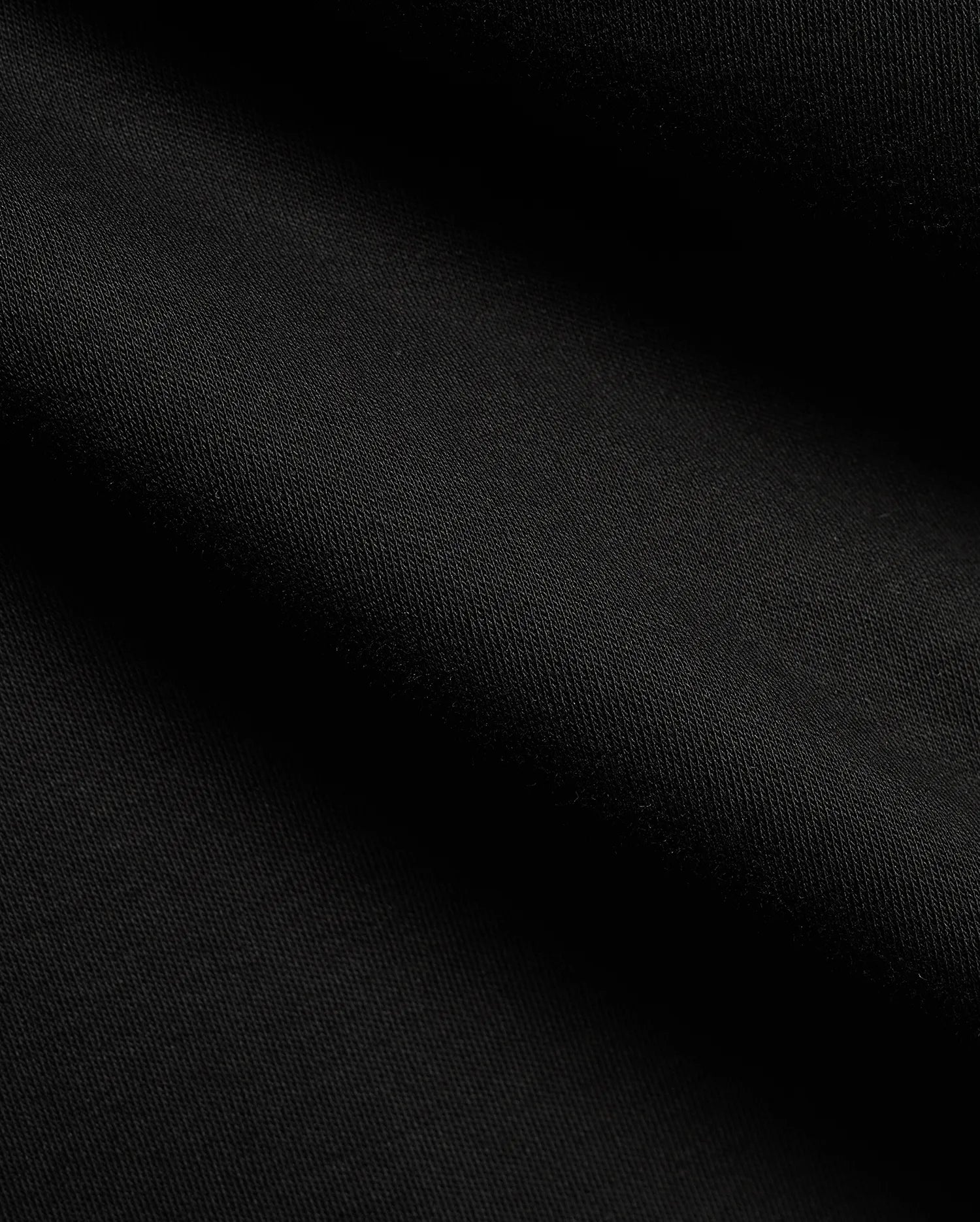 Men's Teddy Johnny Collar Polo, a classic black pique knit with a refined texture, featuring the signature embroidered Psycho Bunny skull logo on the chest for premium streetwear. (6)