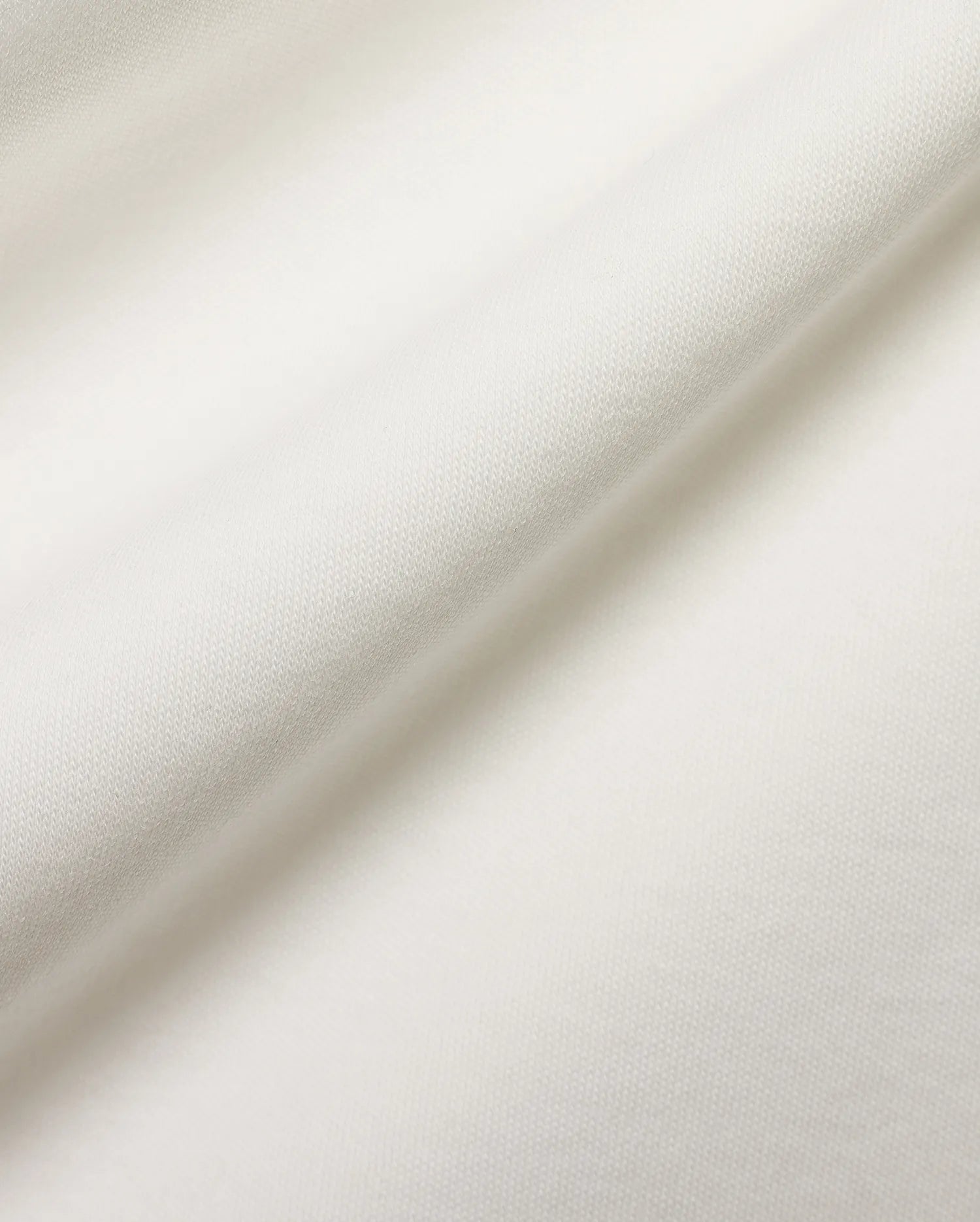 Crisp white pique fabric detail for the premium Psycho Bunny Men's Teddy Johnny Collar Polo, showcasing its refined texture and signature embroidered bunny skull logo. (6)