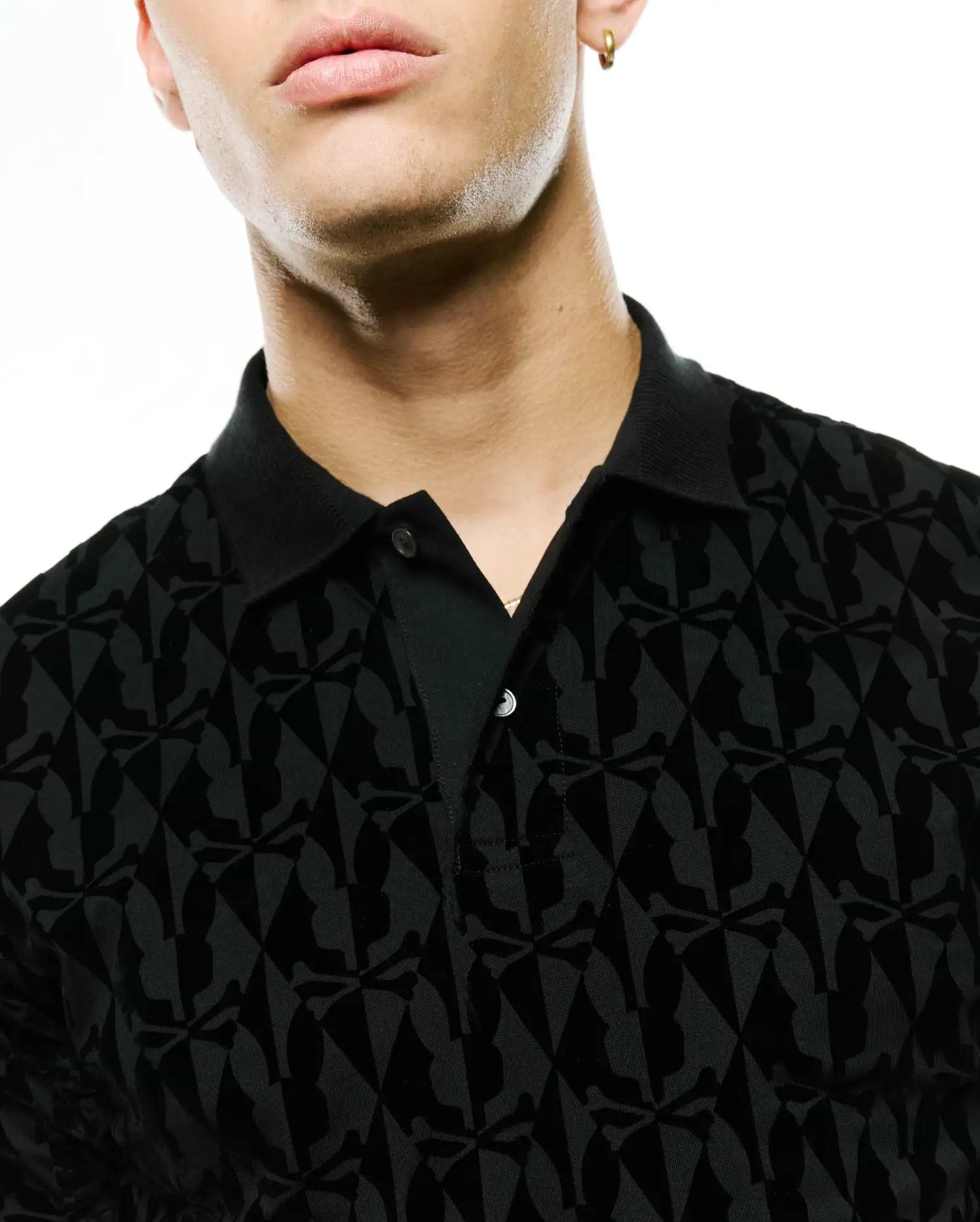 Men's Angus Flocked Polo, black classic fit pique polo featuring a tonal velvet-flocked all-over Psycho Bunny skull and crossbones pattern, complete with a two-button placket. (2)