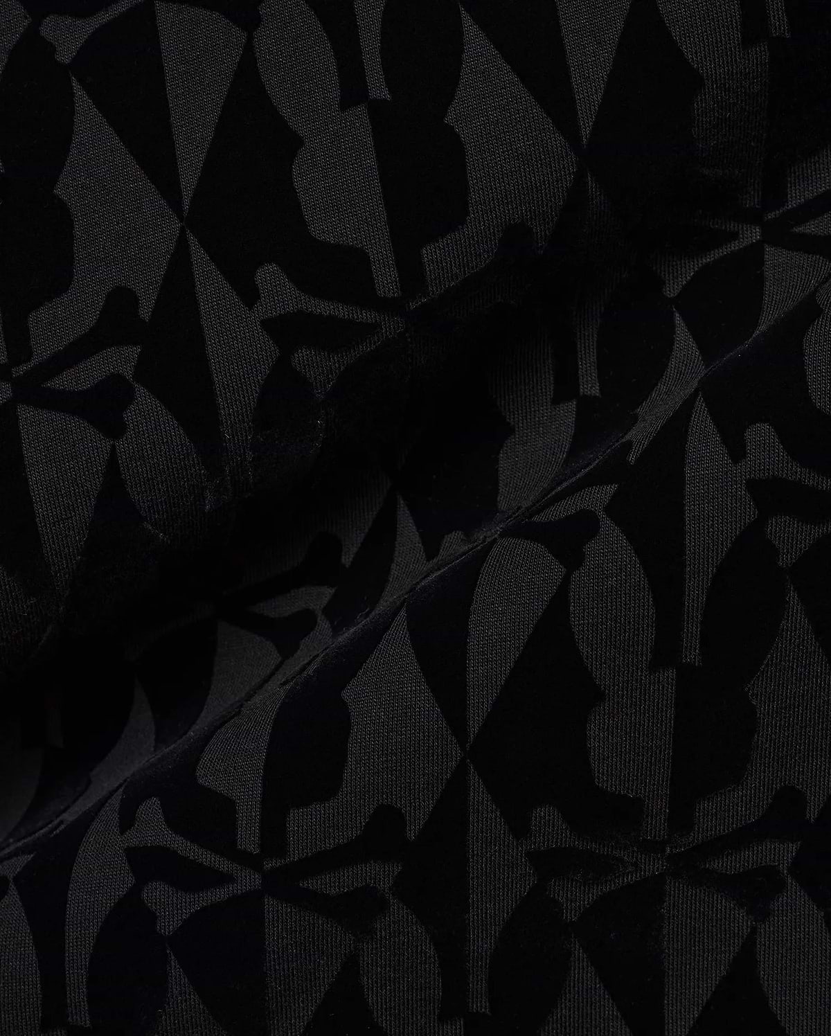 Men's Angus Flocked Polo featuring a tonal black flocked Psycho Bunny skull and crossbones and diamond pattern on a black pique knit fabric. (6)