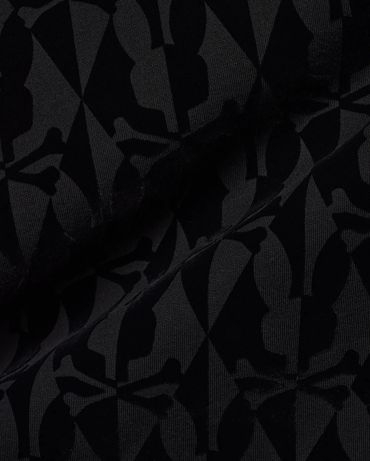 Men's Angus Flocked Polo featuring a tonal black flocked Psycho Bunny skull and crossbones and diamond pattern on a black pique knit fabric. (6)