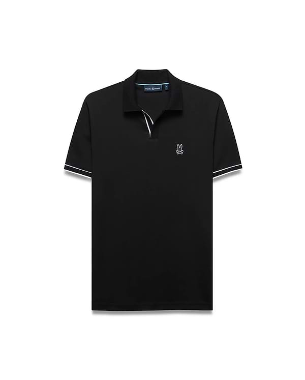 Mens Nasser Interlock Johnny Collar Polo in classic black interlock knit, featuring a white embroidered Psycho Bunny skull logo on the left chest, a Johnny collar, and white double-stripe cuffs.