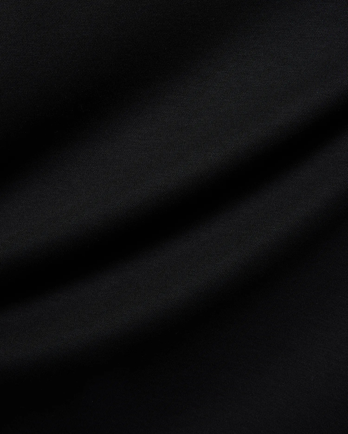 Mens Nasser Interlock Johnny Collar Polo in classic black, featuring smooth interlock fabric and the signature embroidered Psycho Bunny skull logo on the left chest.