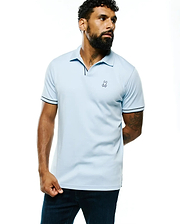 Light blue Mens Nasser Pima Johnny Polo in smooth Pima cotton, featuring navy tipping on the collar and sleeve cuffs, with a small embroidered Psycho Bunny skull logo on the left chest for a classic fit.