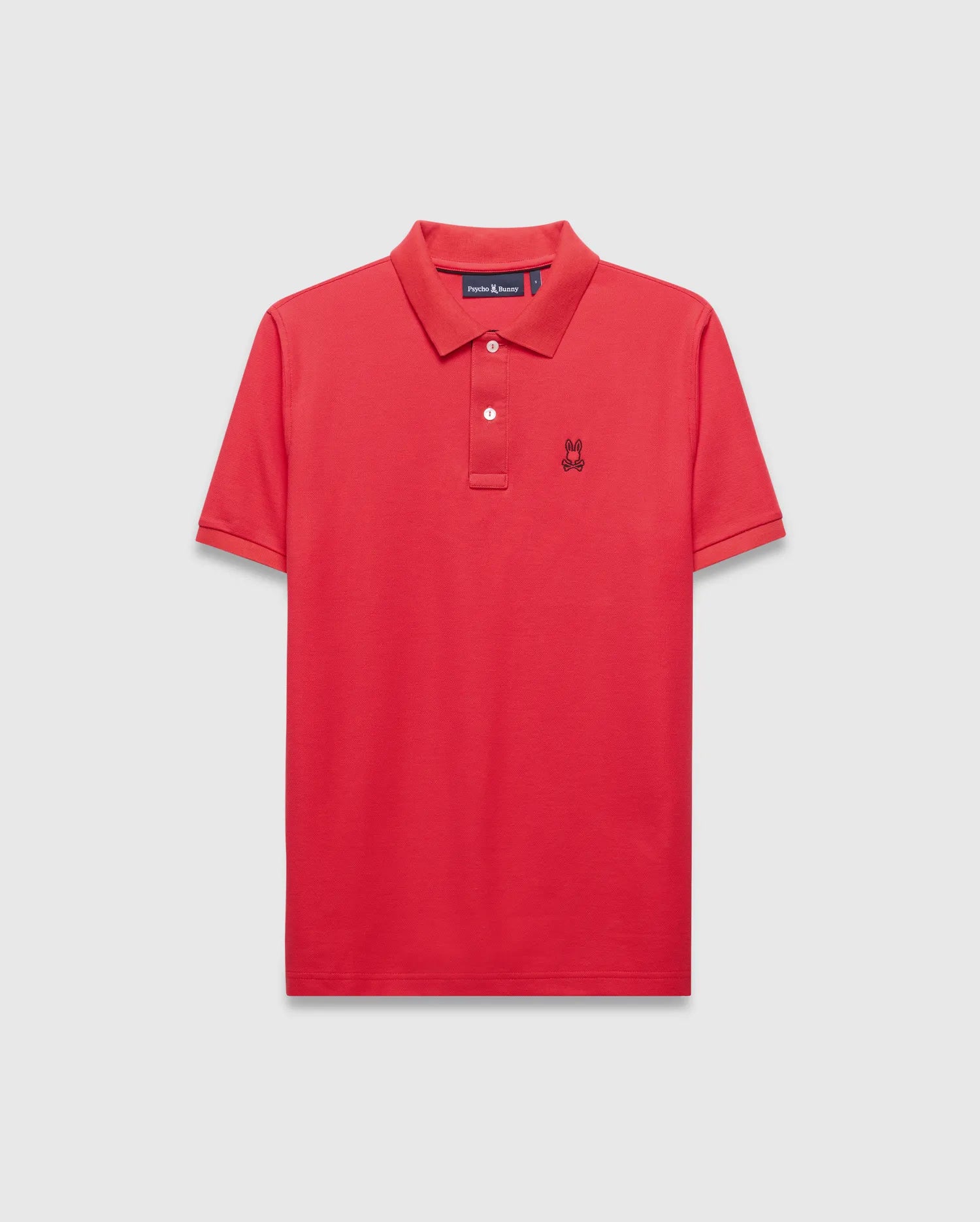 Mens Blythe Pique Polo in vibrant red, featuring a classic fit, pique texture, two-button placket with white buttons, and a small black embroidered Psycho Bunny skull logo on the left chest.