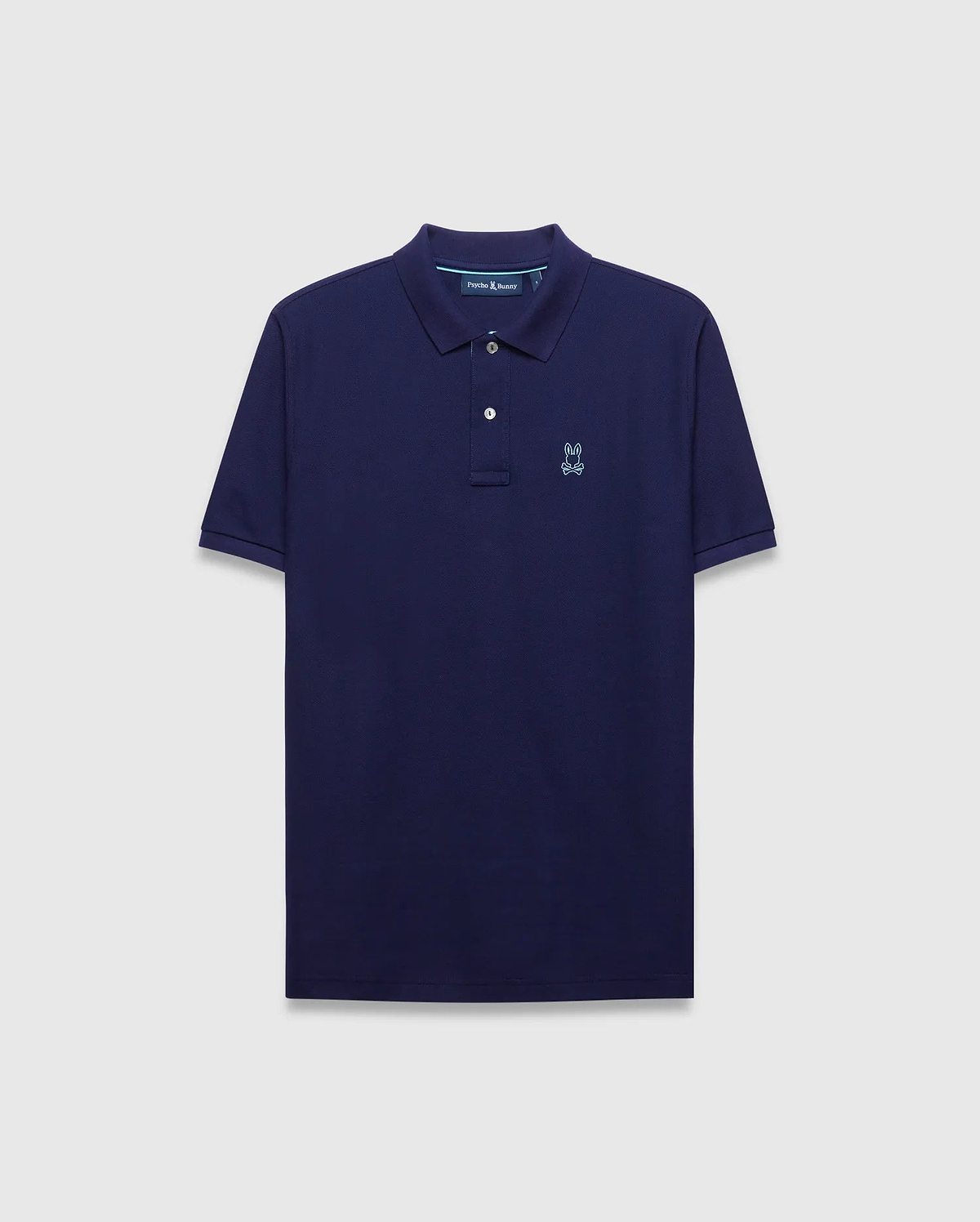 Mens Blythe Pique Polo in navy, classic fit, featuring a light blue embroidered Psycho Bunny skull logo on the left chest and subtle light blue collar trim.