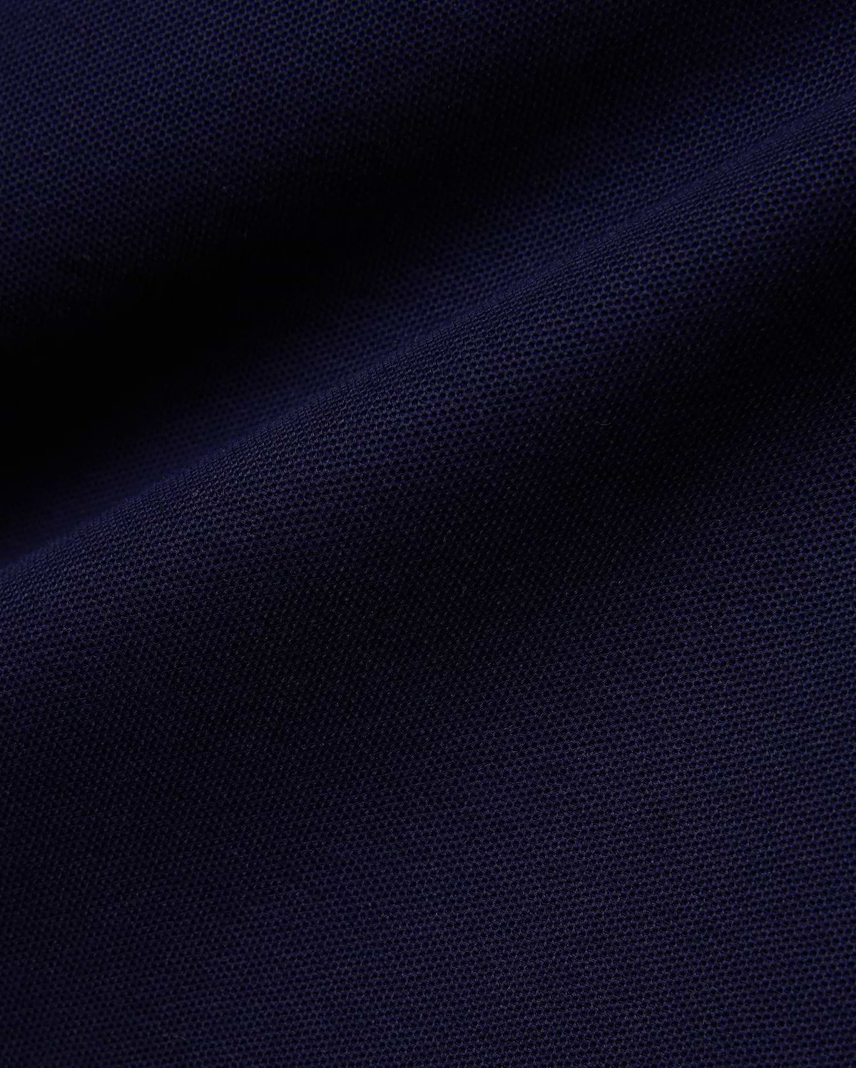 Deep navy Mens Blythe Pique Polo, featuring a classic fit, textured pique fabric, and the iconic small embroidered Psycho Bunny skull logo on the chest.