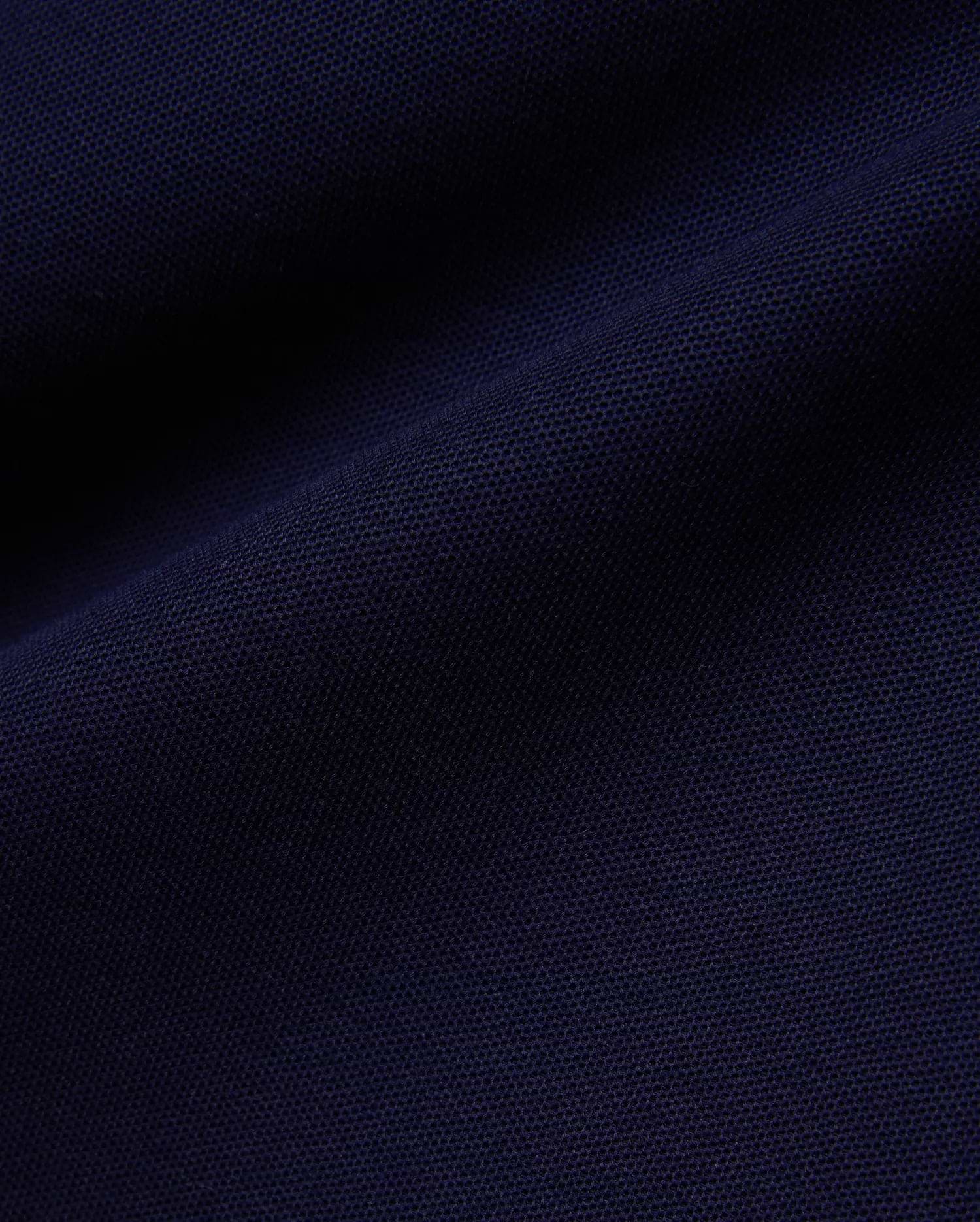 Deep navy Mens Blythe Pique Polo, featuring a classic fit, textured pique fabric, and the iconic small embroidered Psycho Bunny skull logo on the chest.